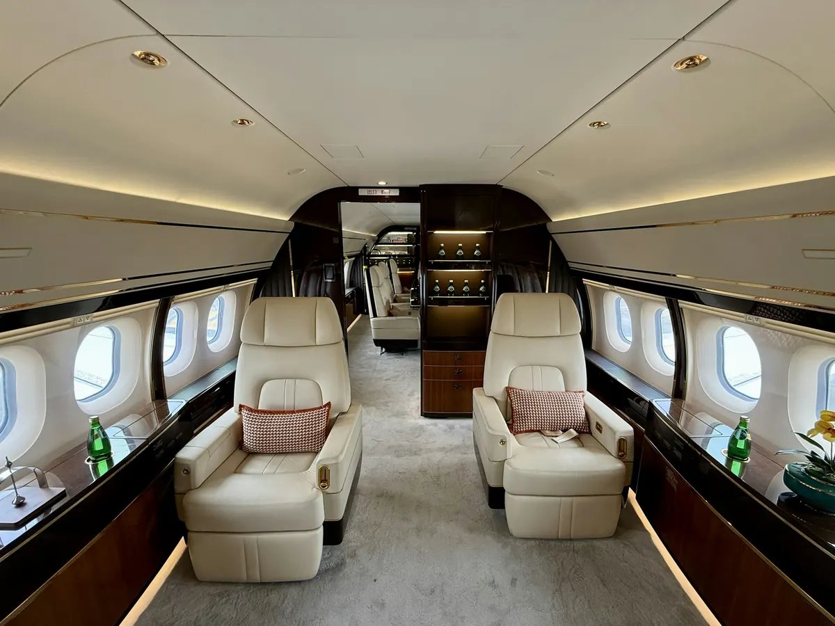 The cream leather cabin of a large business jet